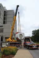 Workers unload a magnetic resonance imaging unit that was installed at Baptist Health Louisville hospital in August 2014.