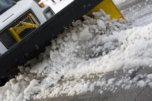 snow plow cleaning the street