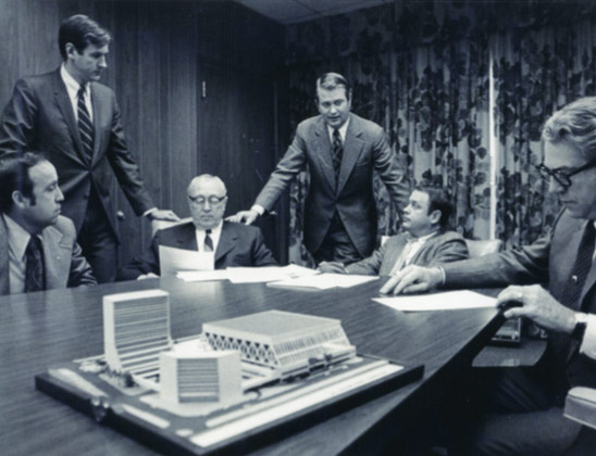 Jim Host, center, addresses and Lexington Center board meeting in the early 1970s as they discuss a preliminary design for Rupp Arena and the Lexington Convention Center complex.