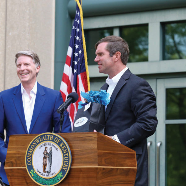 Gov. Andy Beshear, right, joined Fidelity Investments leaders, including Kevin Canafax, vice president of regional public affairs, in celebrating the company’s plans to hire 600 more workers at its Covington campus. The July 2021 announcement marked the second year in a row that Fidelity added hundreds of workers at its NKY site.